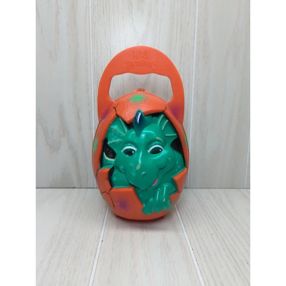 Busch Gardens Land of the Dragons orange egg carry case green baby dragon